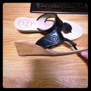 Black wedge Jack Roger sandals.